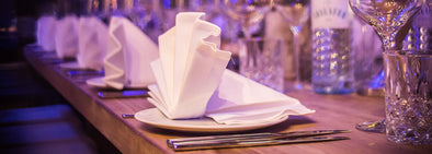 White napkin on white ceramic plate