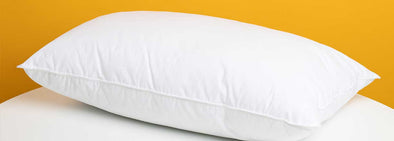 How often should I wash pillows and mattress protectors?