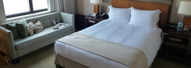white bed sheet linen