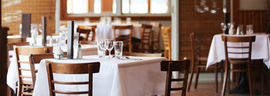 restaurant white tablecloth setup