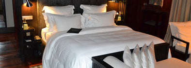 white pillow bedsheet